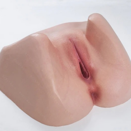 Realistic flesh-toned male masturbator with detailed labia and natural texture