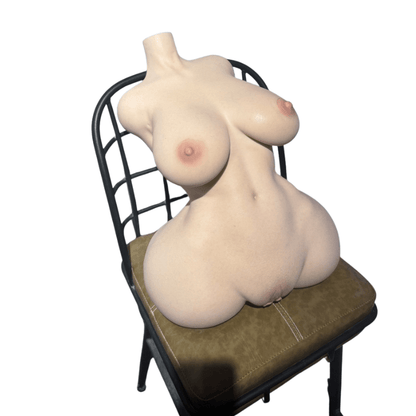 Realistic female torso with detailed breasts and curves seated on a chair, lifelike skin texture and natural coloring