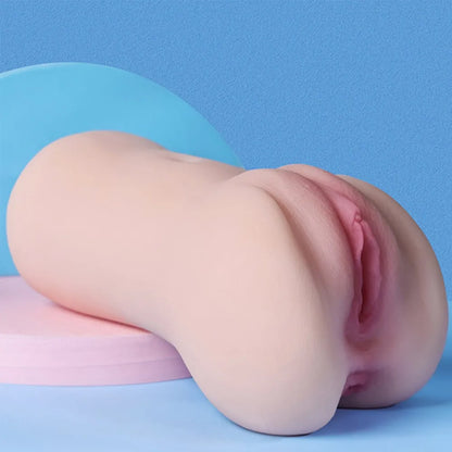 Realistic flesh-toned male masturbator with detailed labia and soft silicone texture on pastel blue background