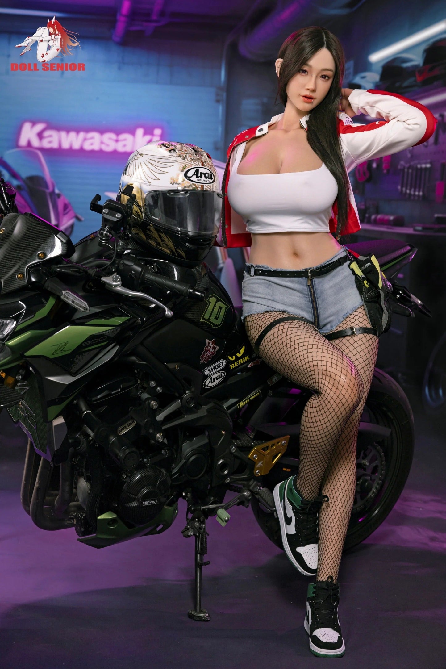 Realistic female doll in white crop top, denim shorts, and fishnet stockings posing beside a green Kawasaki Z900 motorcycle in a garage setting.