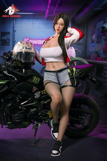 Realistic female doll in racer outfit leaning on motorcycle, wearing fishnets and denim shorts
