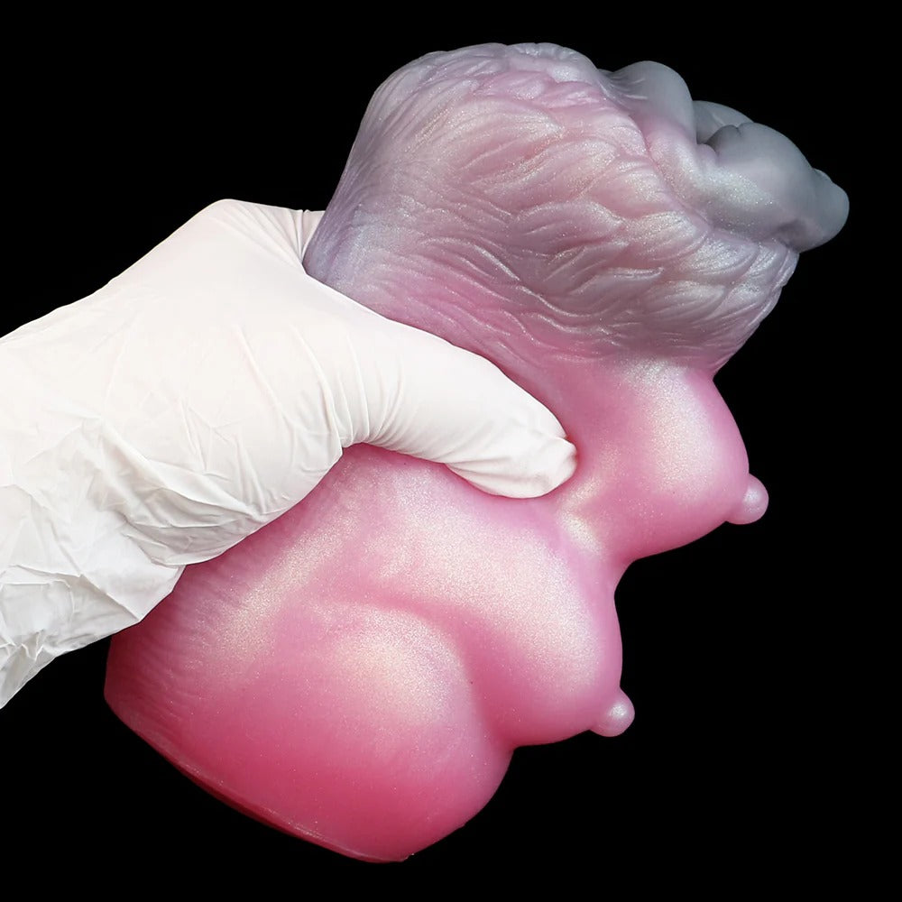 Realistic pink silicone male masturbator with detailed vaginal texture and soft, pliable material