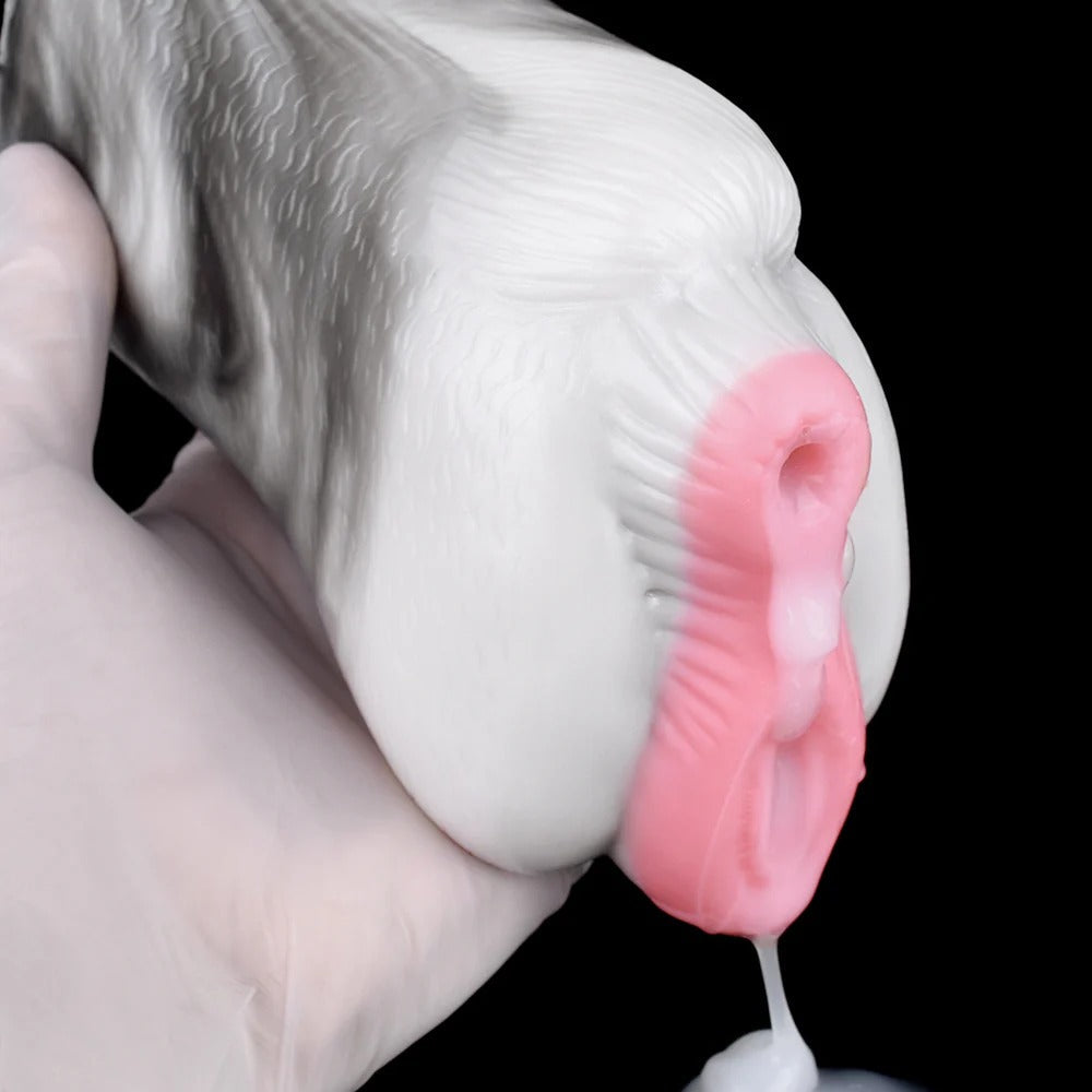 Realistic male masturbator with soft pink interior, textured white exterior, and lifelike vaginal opening