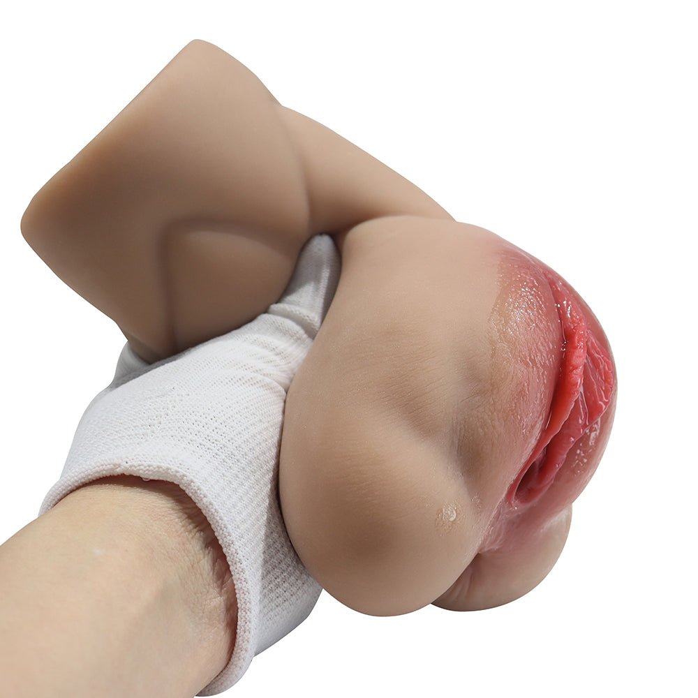 Realistic male masturbator with lifelike skin texture, pink inner lining, and soft silicone material held in hand