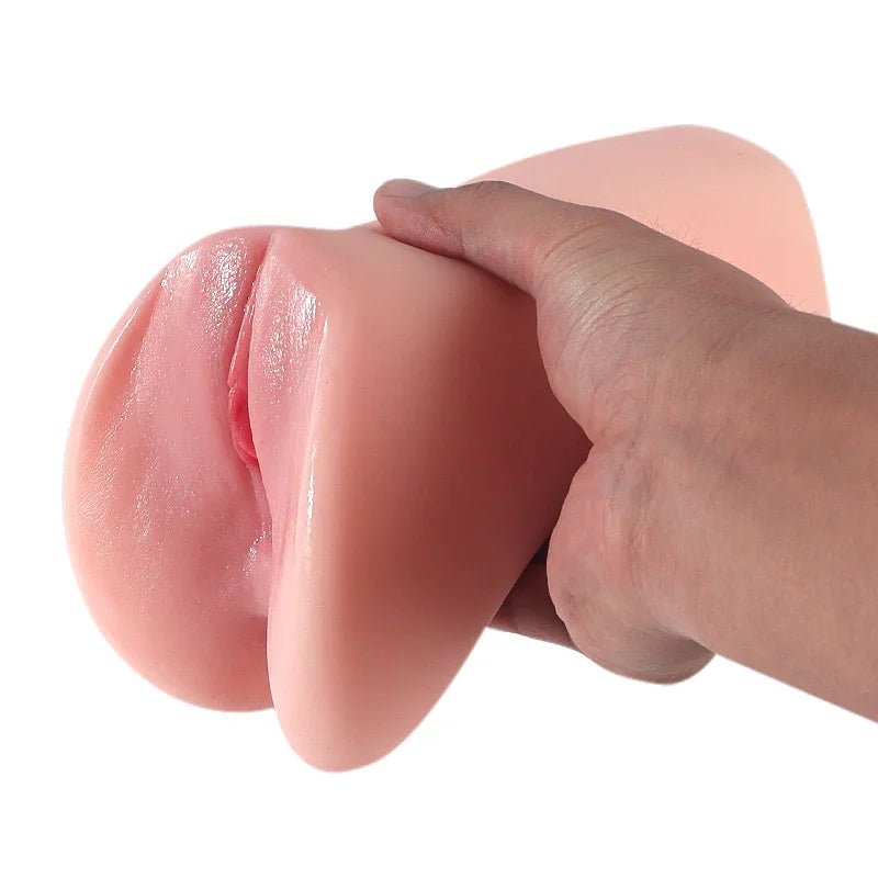 Hand holding realistic pink silicone male masturbator with detailed labia and soft texture