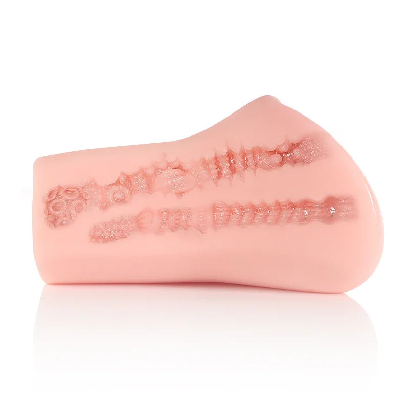 Pink realistic male masturbator with textured internal ridges and suction cup base