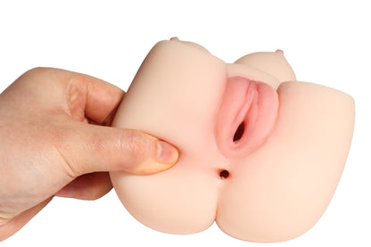 Hand holding realistic silicone male masturbator with detailed vaginal opening and soft texture