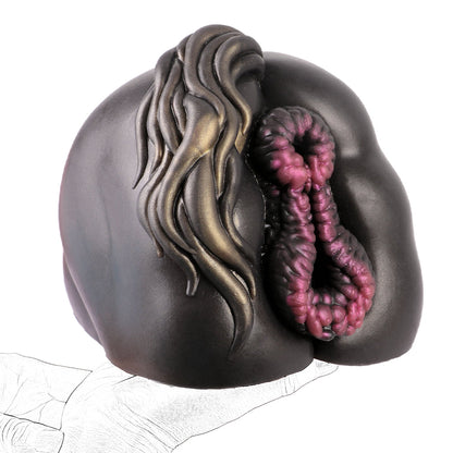 Realistic male masturbator with textured pink interior and sculpted dark exterior, held in hand.