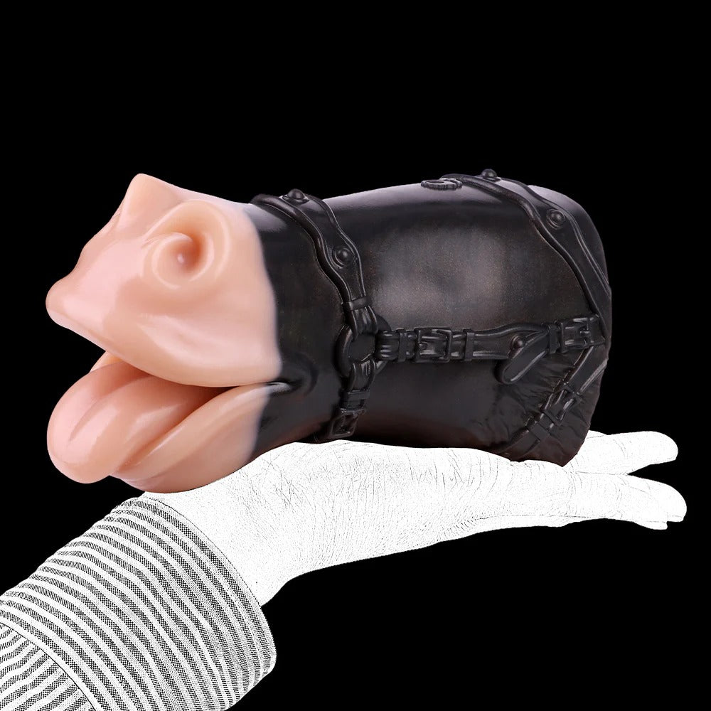 Realistic flesh-toned oral sleeve with black harness, held in gloved hand, soft silicone texture