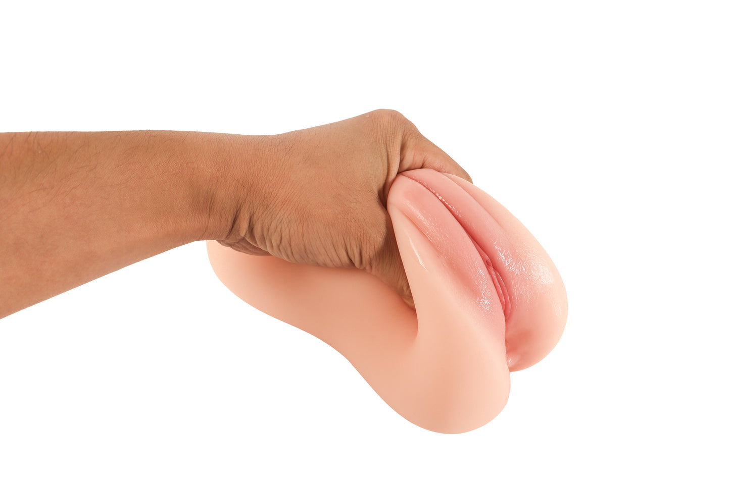 Hand squeezing realistic pink flesh-toned male masturbator with soft, pliable texture and detailed labia